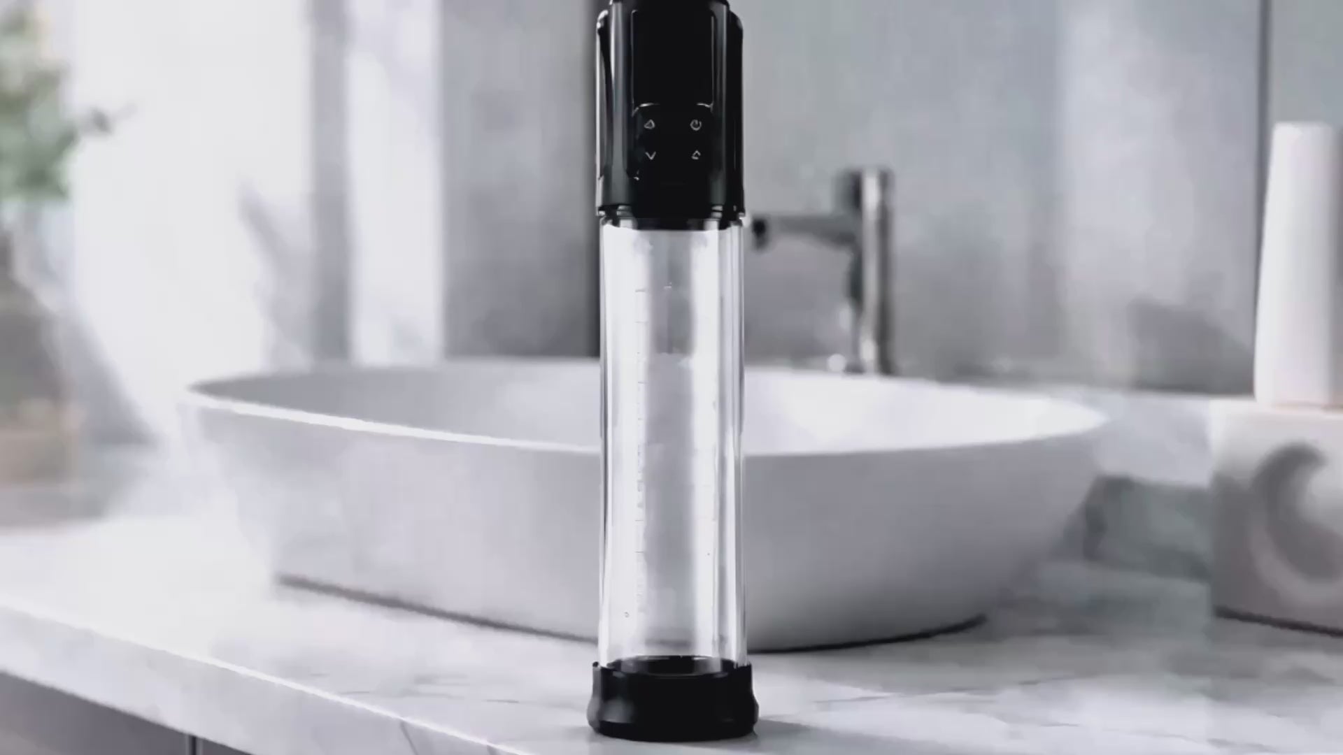 Erojoy Vacumate Automatic penis pump standing on a bathroom counter